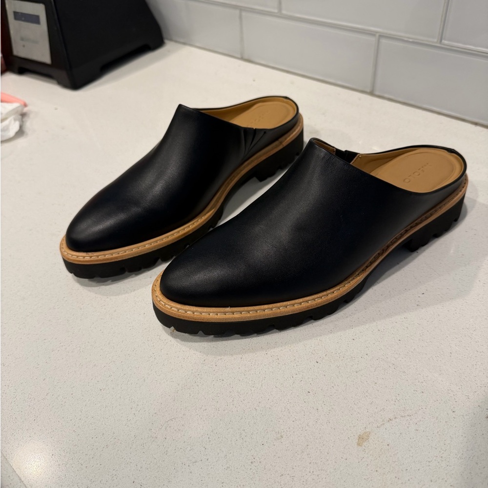Nisolo Black Leather Mules with Tan Sole